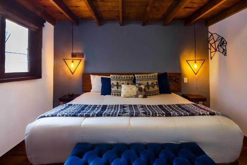 Postel nebo postele na pokoji v ubytování Hotel Kali