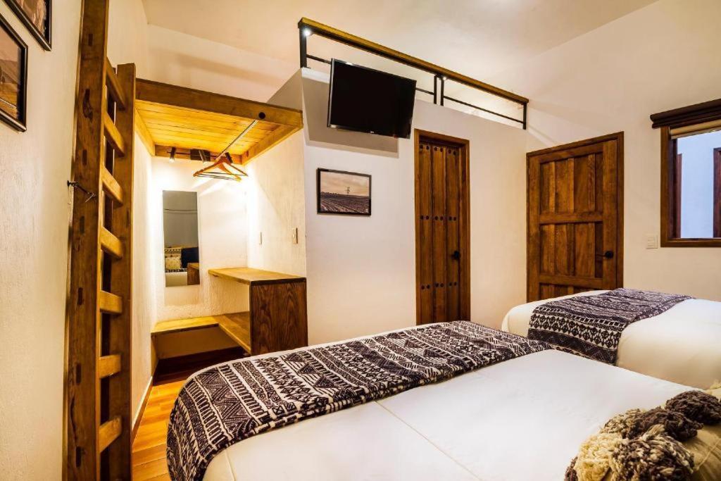 Postel nebo postele na pokoji v ubytování Hotel Kali