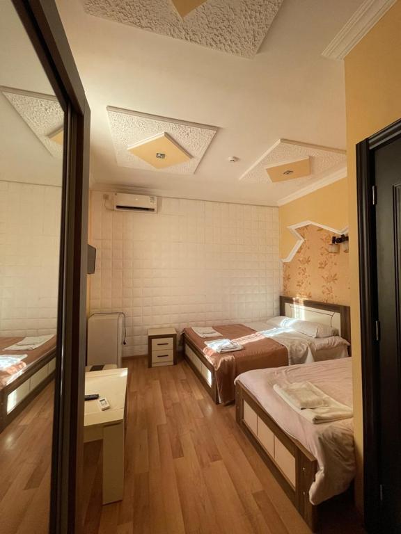 Postel nebo postele na pokoji v ubytování Lux Palace Hotel