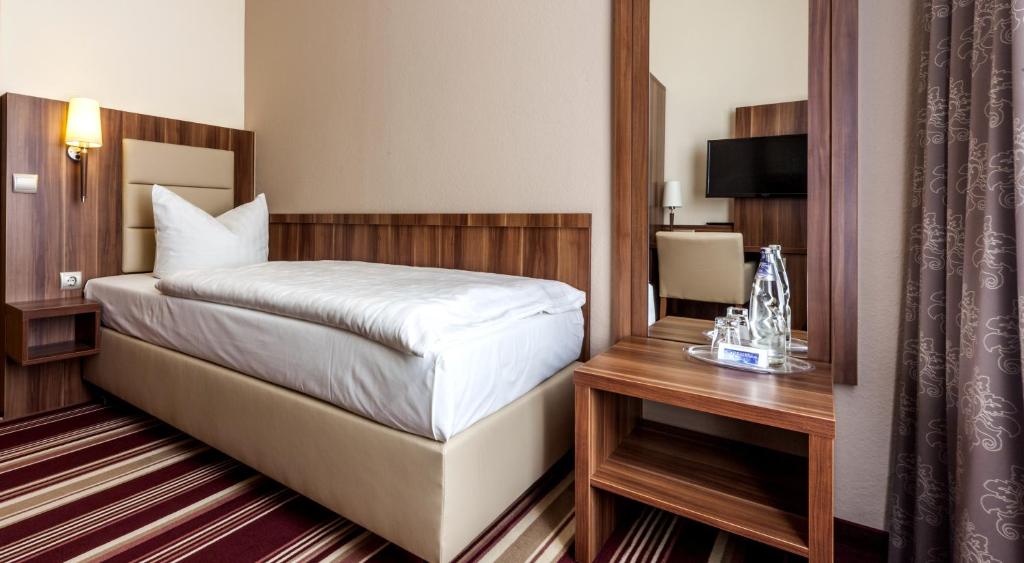 Postel nebo postele na pokoji v ubytování Hotel Burgas