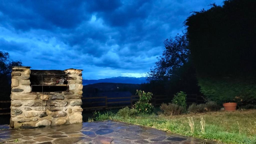 a stone wall with a view of the mountains at Maison en Cerdagne avec belle vue in Enveitg