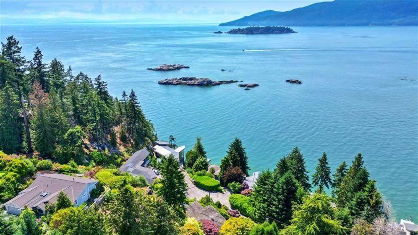 an island in the middle of a body of water at Vancouver sea view Palace inn in West Vancouver