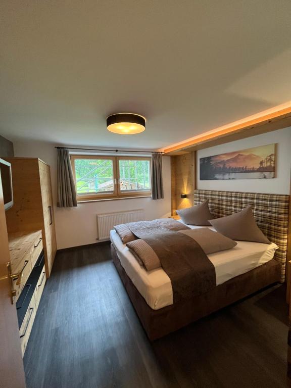 Postel nebo postele na pokoji v ubytování Ferienwohnung Tux