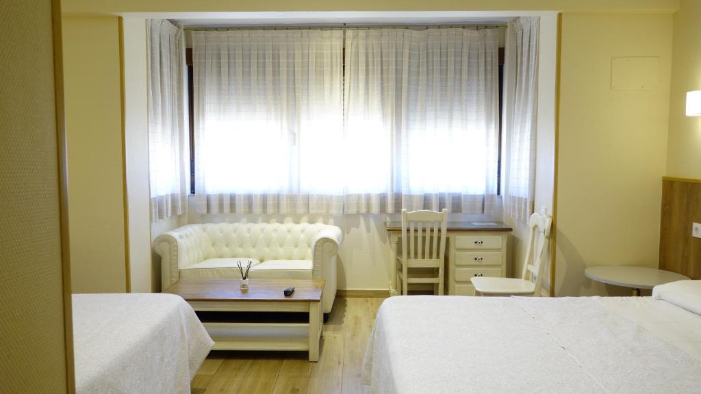 Postel nebo postele na pokoji v ubytování Trípolis Toledo