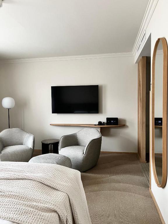 ADELANTE Boutique Hotelにあるテレビまたはエンターテインメントセンター