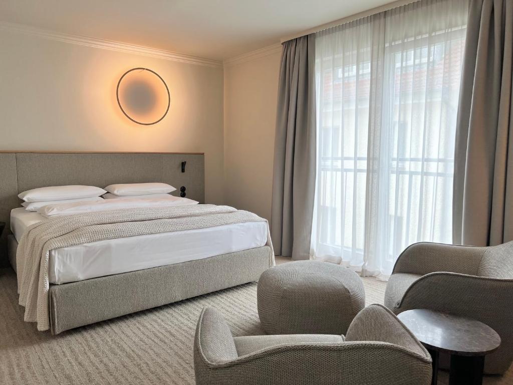 ADELANTE Boutique Hotelにあるベッド
