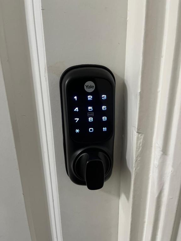 a remote control sticking out of a door at Belgrave Studio Apartments, Westminster London in London