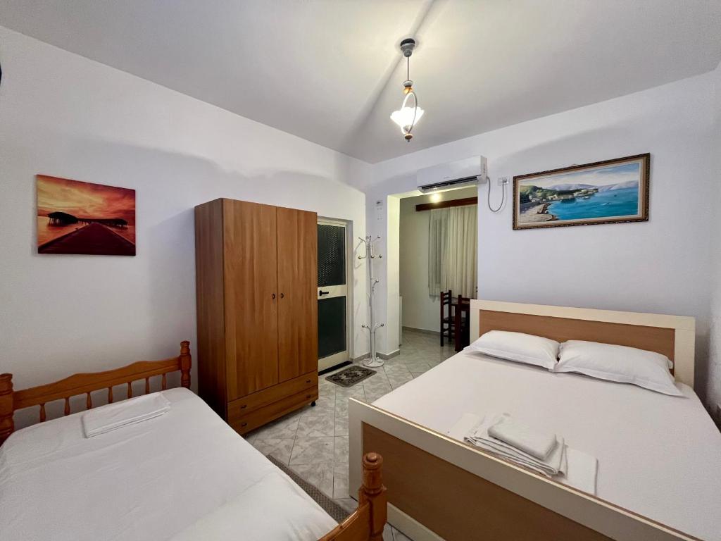 Postel nebo postele na pokoji v ubytování Rei’s place