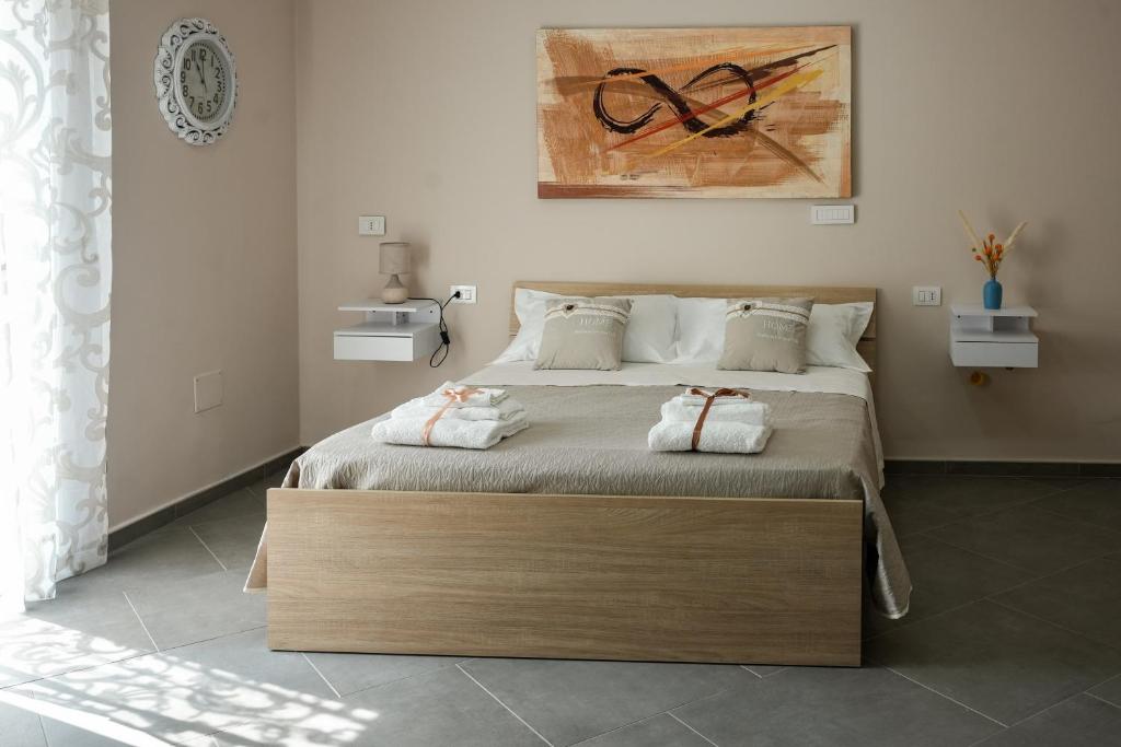 Villa Falcone tesisinde bir odada yatak veya yataklar