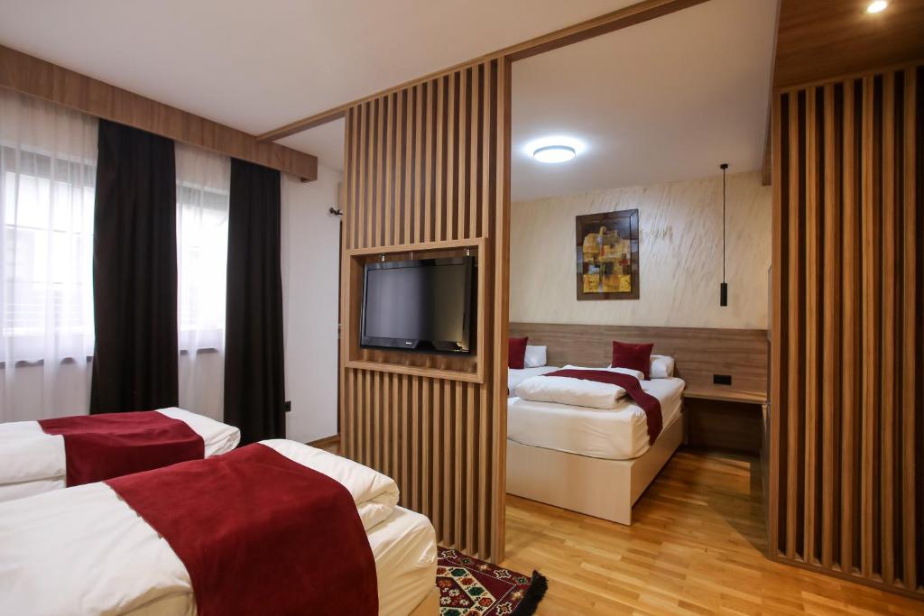 Postel nebo postele na pokoji v ubytování Hotel Emen