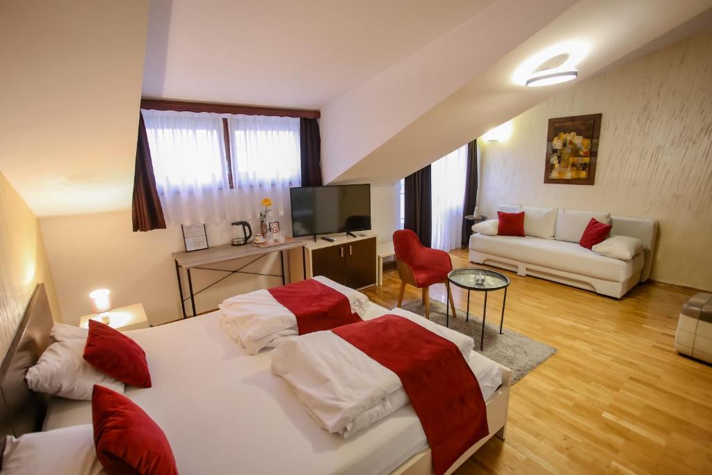 Postel nebo postele na pokoji v ubytování Hotel Emen