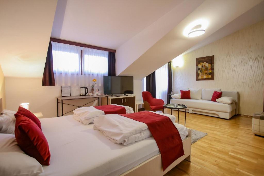 Postel nebo postele na pokoji v ubytování Hotel Emen