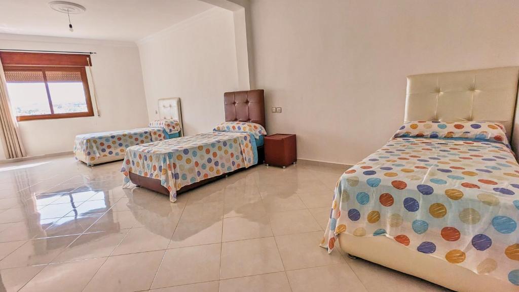 Postel nebo postele na pokoji v ubytování Oued Laou Apartment
