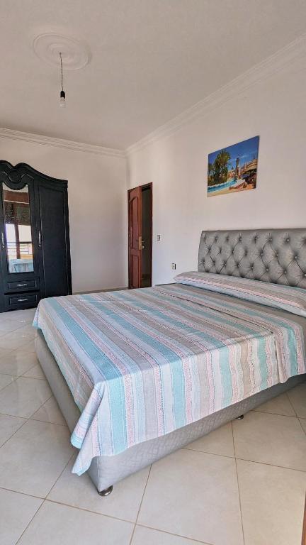Postel nebo postele na pokoji v ubytování Oued Laou Apartment