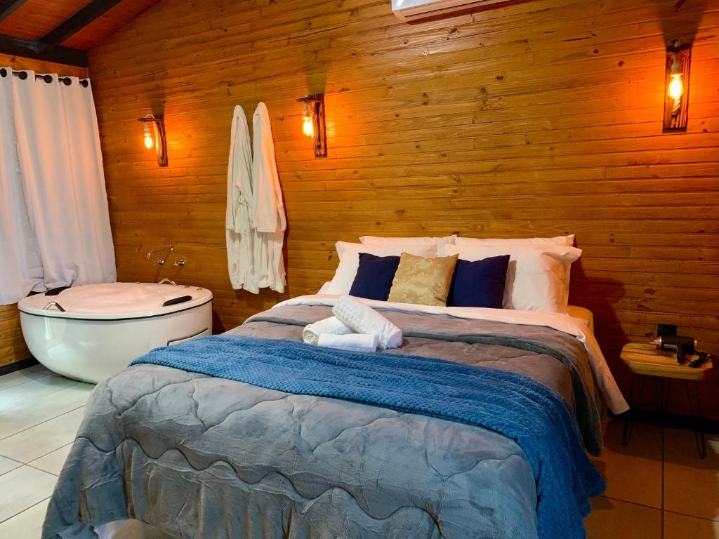 Postel nebo postele na pokoji v ubytování Cabanas Flor de Goiaba