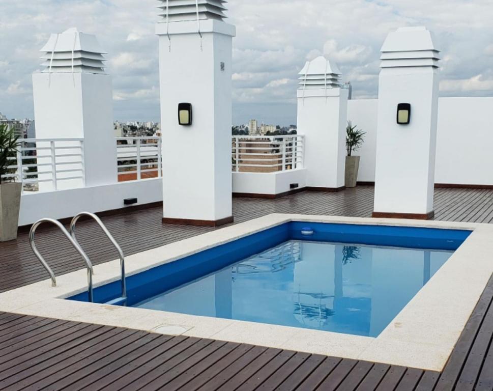 a swimming pool on the roof of a building at Altos de colon in Cordoba