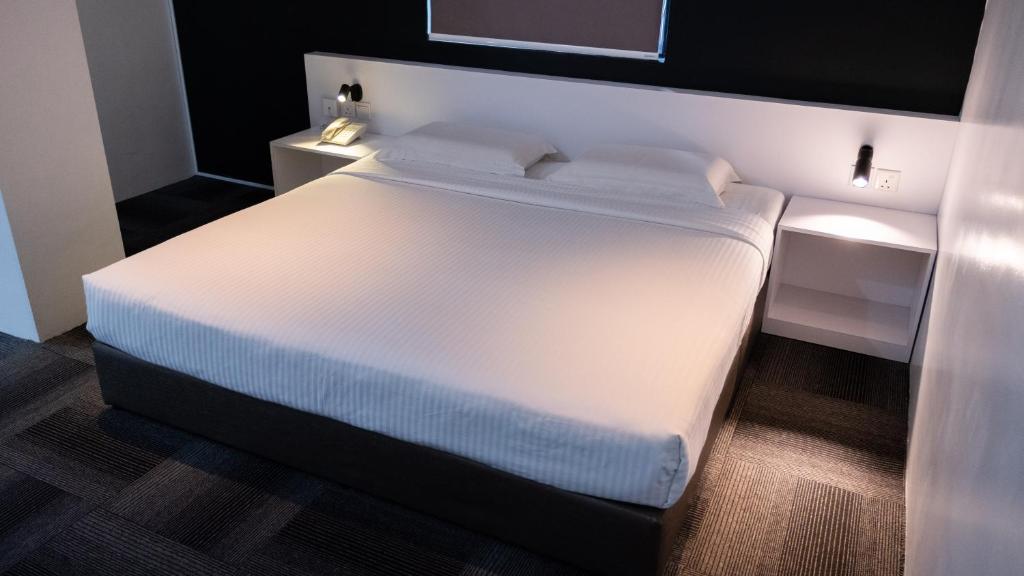 Postel nebo postele na pokoji v ubytování Beverly Hotel