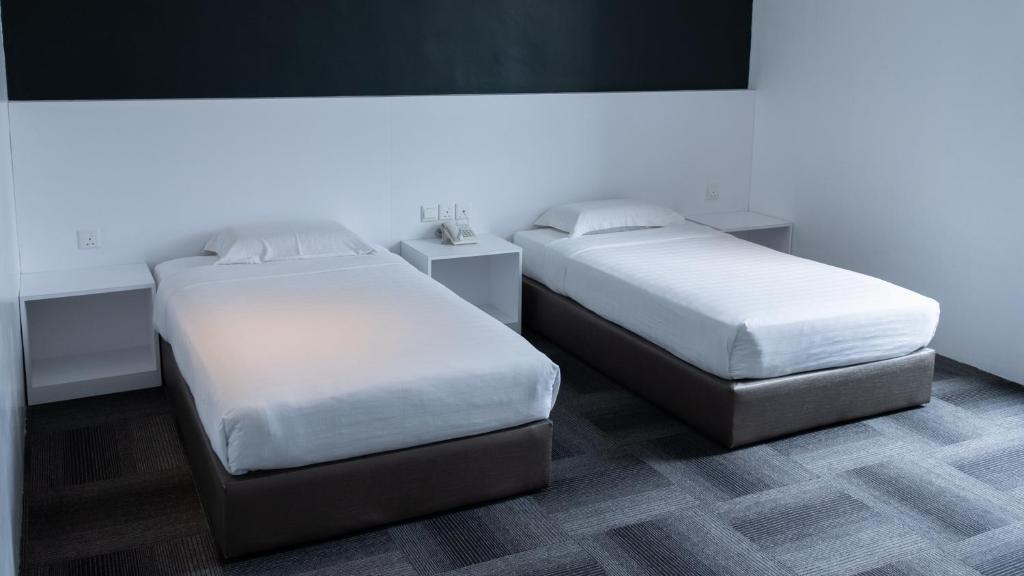 Postel nebo postele na pokoji v ubytování Beverly Hotel