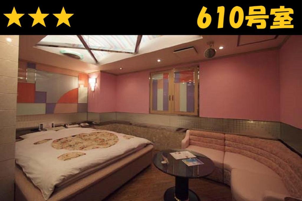 Postel nebo postele na pokoji v ubytování HOTEL Us Racecourse Adult only