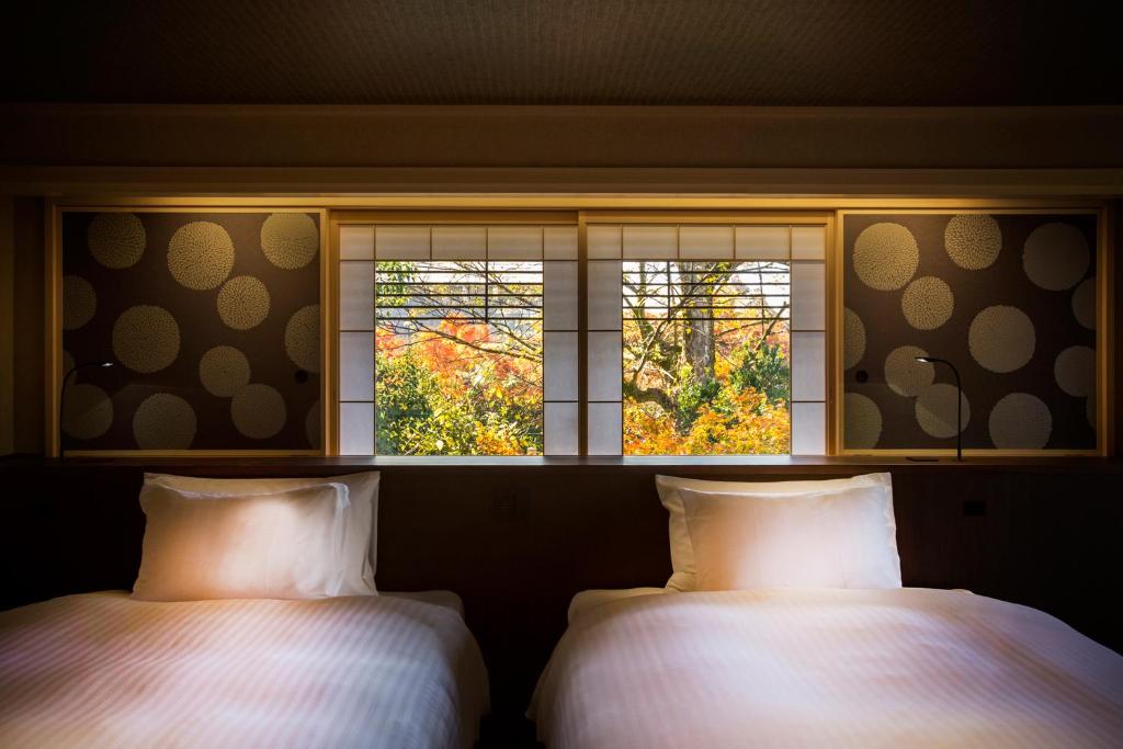 Hotel Yuraku Kyo-yasakaにあるベッド