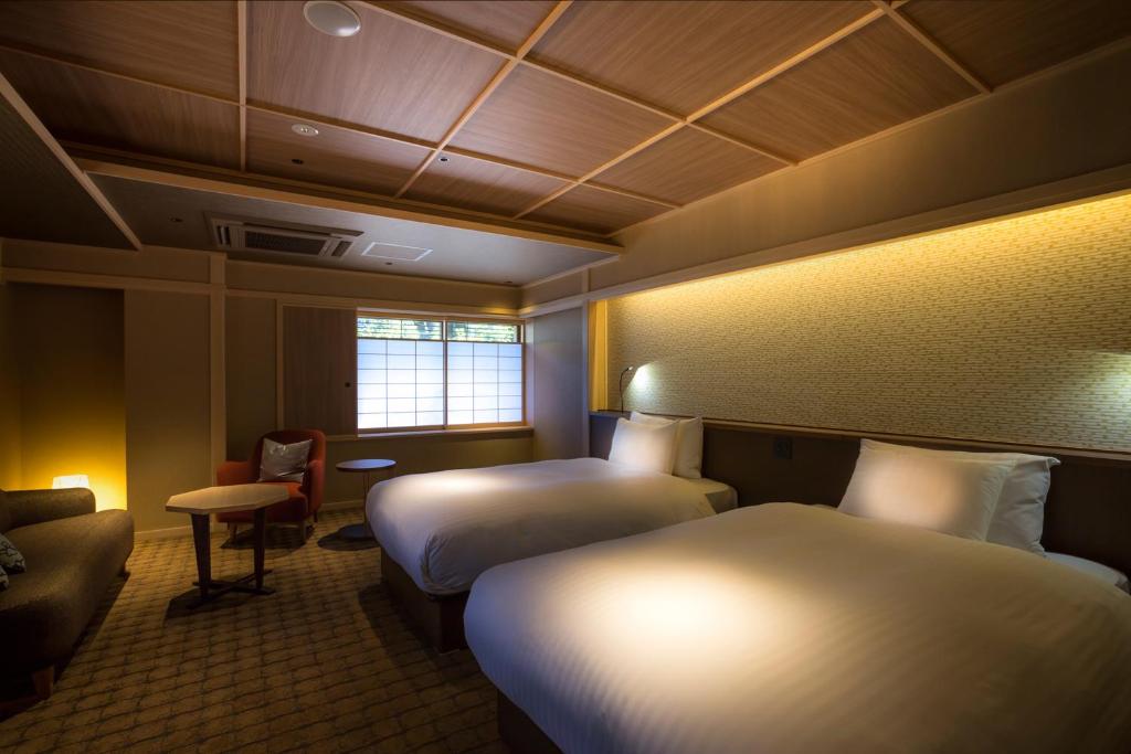 Hotel Yuraku Kyo-yasakaにあるベッド