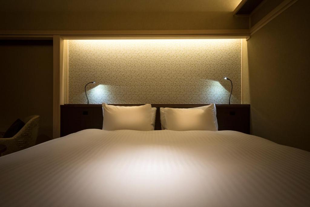 Hotel Yuraku Kyo-yasakaにあるベッド