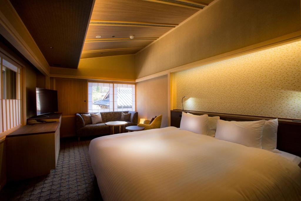 Hotel Yuraku Kyo-yasakaにあるベッド