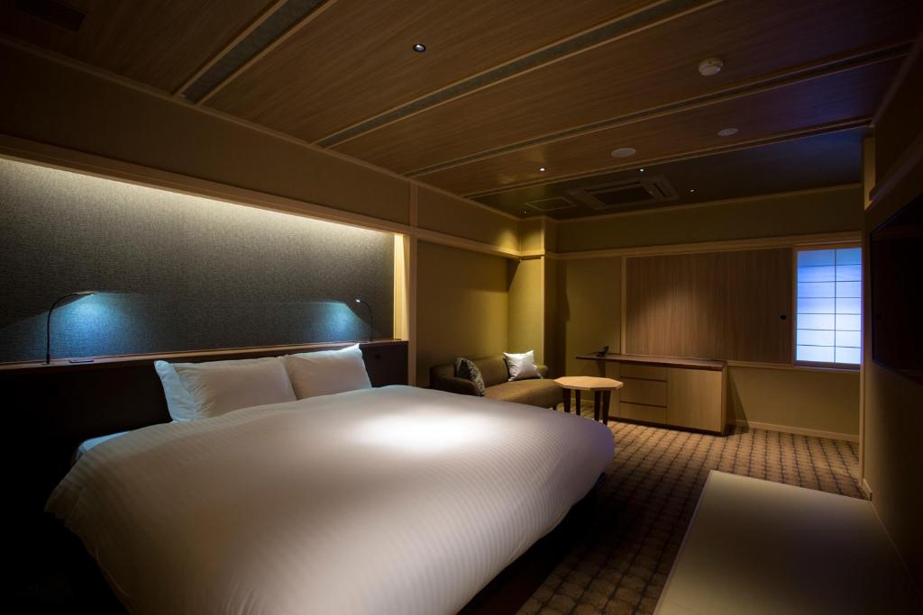 Hotel Yuraku Kyo-yasakaにあるベッド