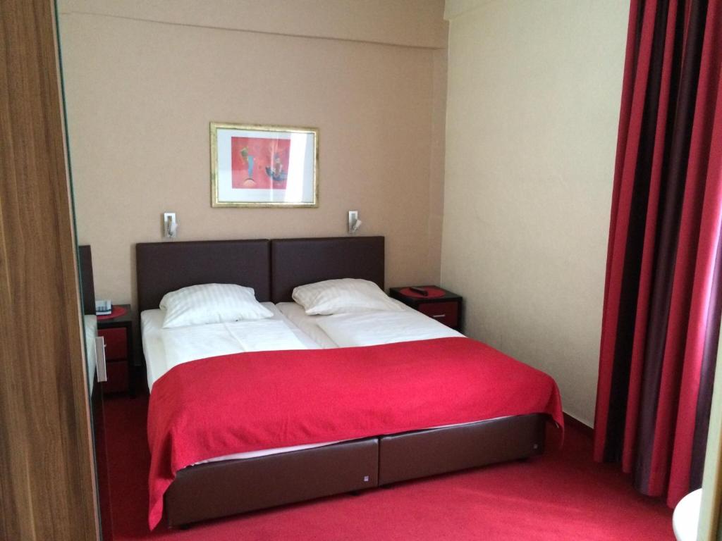 Ein Bett oder Betten in einem Zimmer der Unterkunft Hotel Imperial
