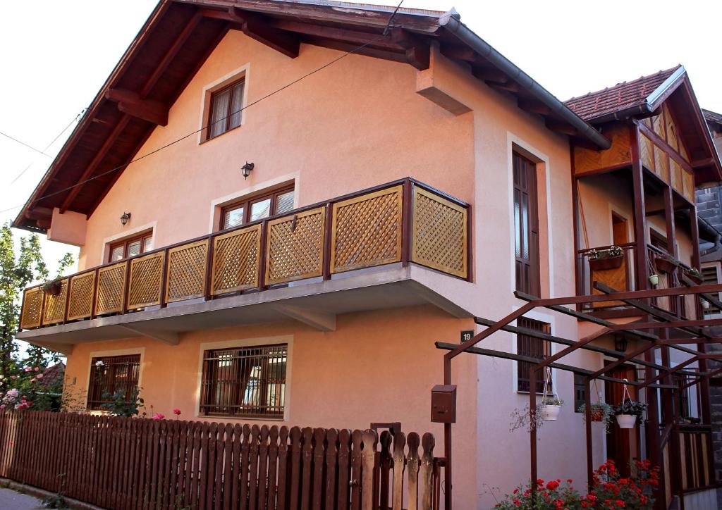 a house with a balcony on the side of it at SARAJEVO HOME in Sarajevo