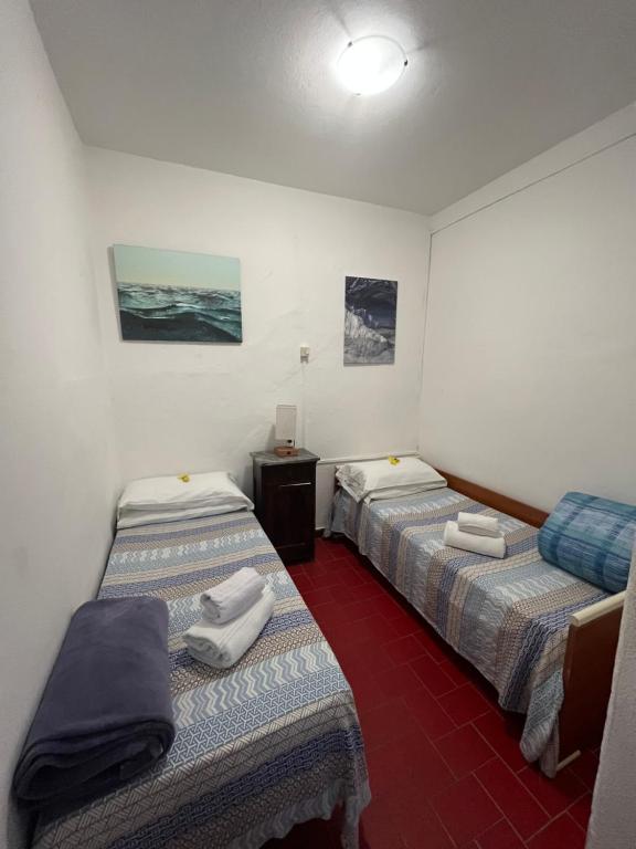 Postel nebo postele na pokoji v ubytování Lisetta Rooms