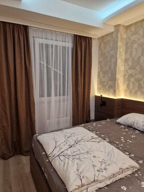 Postel nebo postele na pokoji v ubytování MB Apartments
