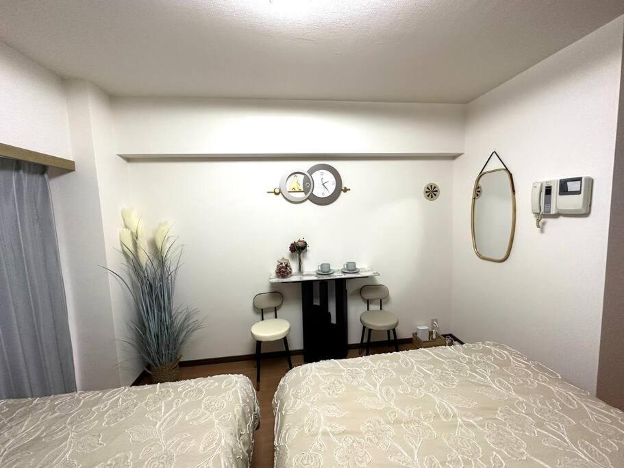 Krevet ili kreveti u jedinici u objektu K Shinjuku area-MAX 4p-新宿中心地域-步行可到新宿大久保歌舞伎町-可住4人