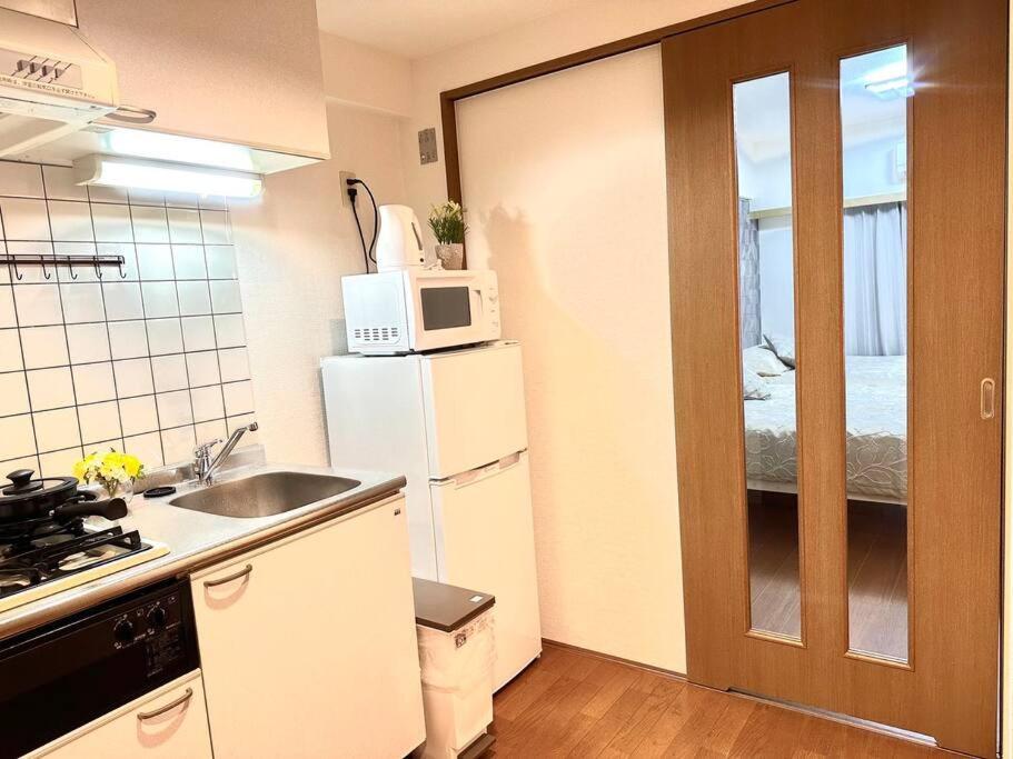 Kuhinja ili čajna kuhinja u objektu K Shinjuku area-MAX 4p-新宿中心地域-步行可到新宿大久保歌舞伎町-可住4人