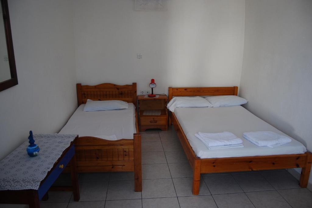 Postel nebo postele na pokoji v ubytování Apollo Rooms