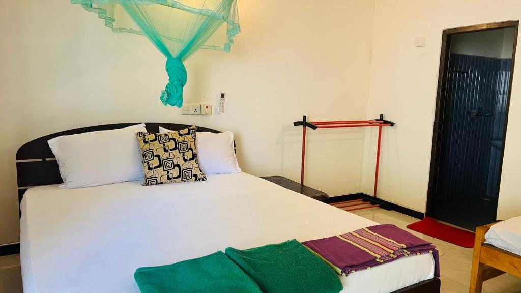 Postel nebo postele na pokoji v ubytování Lal Home Stay