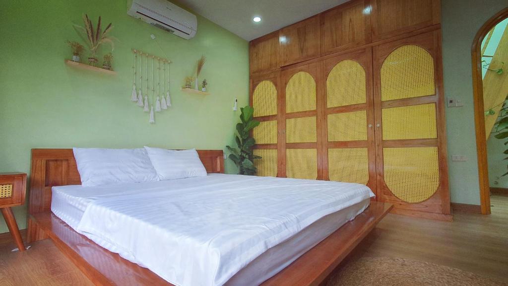 Postel nebo postele na pokoji v ubytování Dốc Chill - Villa gần Ba Vì, view núi, gần hồ, 40ph đi từ trung tâm Hà Nội