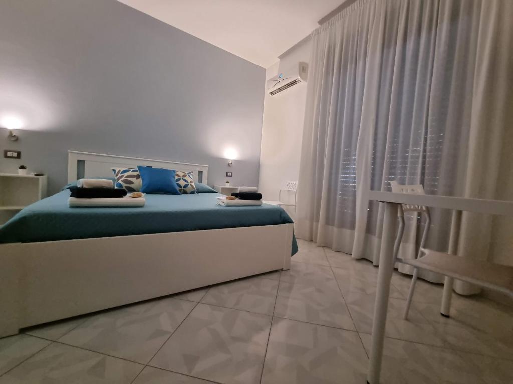 Postel nebo postele na pokoji v ubytování B&B TERRA DI MITI