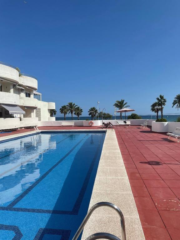 a swimming pool on the side of a building at La Marinada in Cambrils