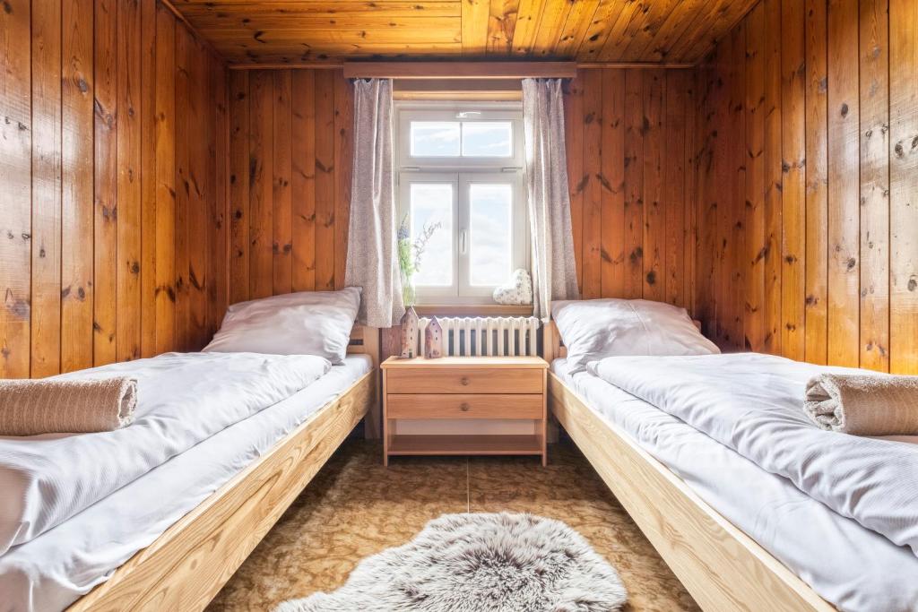 Postel nebo postele na pokoji v ubytování Lysečinská bouda