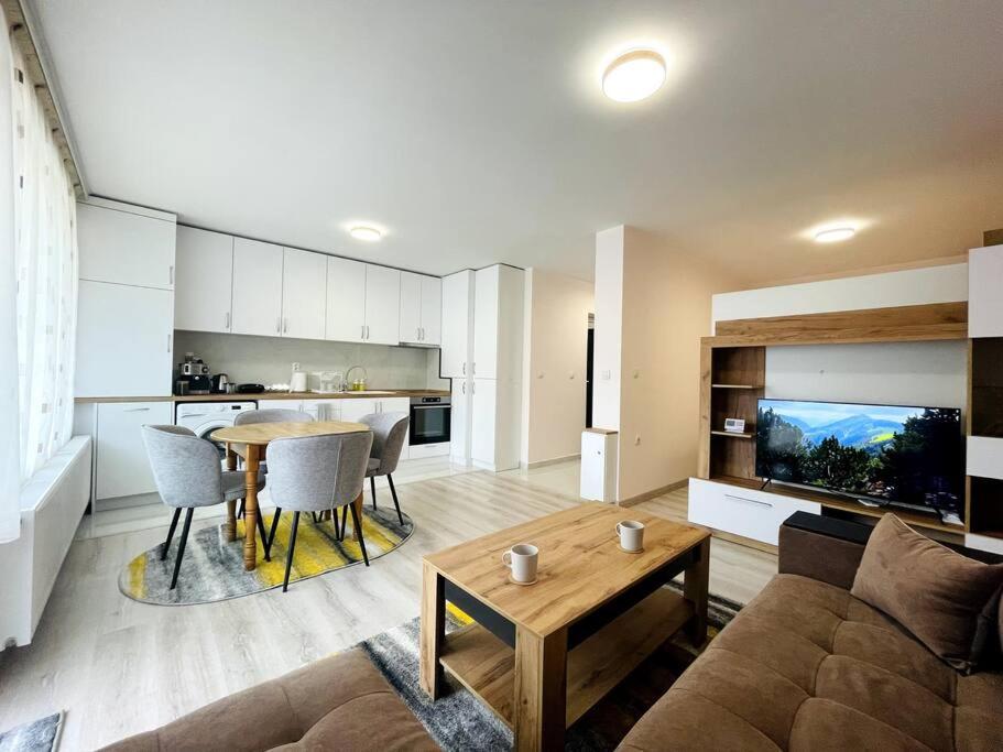 a living room with a couch and a table at Katerina Apartments in Velingrad