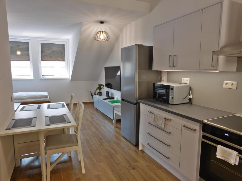 A kitchen or kitchenette at Berki Apartman