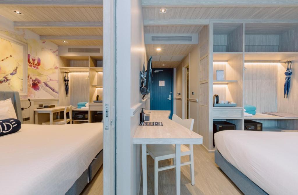 Postel nebo postele na pokoji v ubytování Hotel Tide Phuket Beachfront