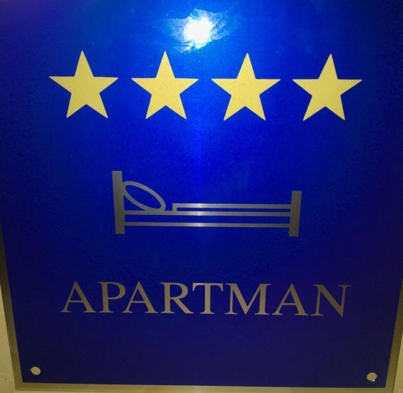 a blue sign with five stars and a sign with a sign at Art De Lux apartment in Višnjan