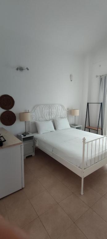 Postel nebo postele na pokoji v ubytování Neaktion Apartments