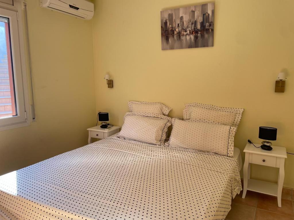 Postel nebo postele na pokoji v ubytování Casa Bosc (Residencial Begur)