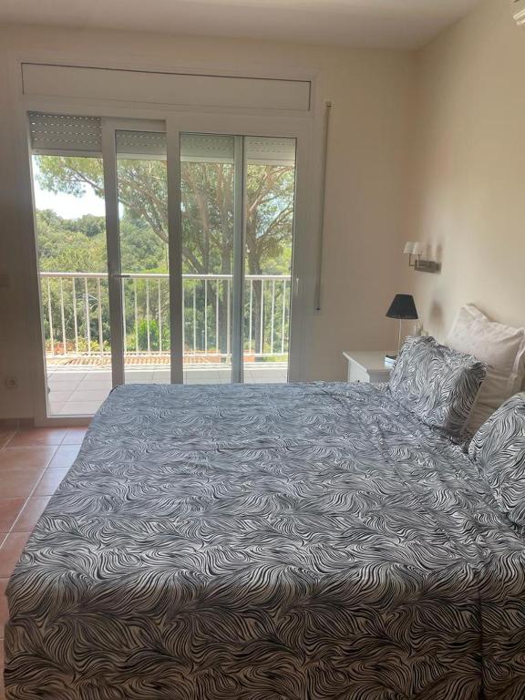 Postel nebo postele na pokoji v ubytování Casa Bosc (Residencial Begur)