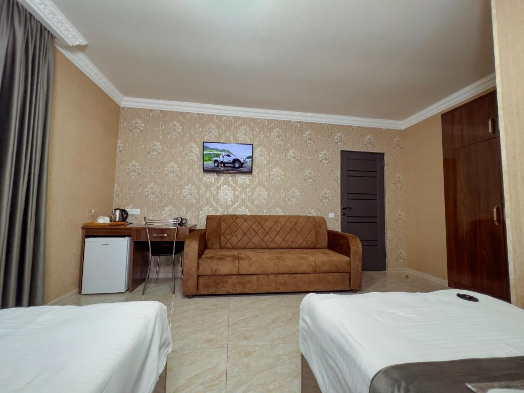 Postel nebo postele na pokoji v ubytování Opera Avenue Hotel