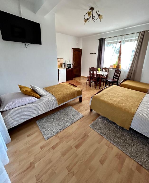 Posteľ alebo postele v izbe v ubytovaní Pokoje Gościnne U Wioli