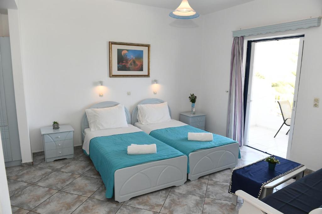 Ένα ή περισσότερα κρεβάτια σε δωμάτιο στο MIMIS APARTMENTS